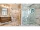 Elegant bathroom with a frameless shower and double vanity at 269 Pine Ranch Trl, Osprey, FL 34229