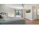 Comfortable bedroom with a view and wood flooring at 269 Pine Ranch Trl, Osprey, FL 34229