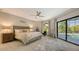 Spacious bedroom with pool view and large sliding glass doors at 269 Pine Ranch Trl, Osprey, FL 34229