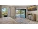 Bright bedroom with pool access and large windows at 269 Pine Ranch Trl, Osprey, FL 34229