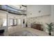 Bright entry with high ceilings, tile floors, and a modern staircase at 269 Pine Ranch Trl, Osprey, FL 34229