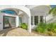 Modern double door entry with arched entryway and stone walkway at 269 Pine Ranch Trl, Osprey, FL 34229