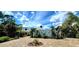 Stunning contemporary home with landscaped grounds and a paved driveway at 269 Pine Ranch Trl, Osprey, FL 34229