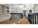 Bright hallway with hardwood floors and modern railing at 269 Pine Ranch Trl, Osprey, FL 34229