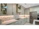 Modern kitchen with white cabinets, quartz countertops, and a gas cooktop at 269 Pine Ranch Trl, Osprey, FL 34229