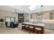 Modern kitchen with island, white cabinets, and skylight at 269 Pine Ranch Trl, Osprey, FL 34229