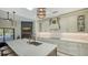 Open kitchen with island, custom cabinetry, and high-end appliances at 269 Pine Ranch Trl, Osprey, FL 34229