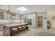 Bright kitchen features an island, white cabinets, and stainless steel appliances at 269 Pine Ranch Trl, Osprey, FL 34229