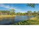 Scenic view of a tranquil lake in a residential area at 269 Pine Ranch Trl, Osprey, FL 34229