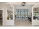 Open living space with large windows, pool view, and stylish decor at 269 Pine Ranch Trl, Osprey, FL 34229