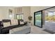 Comfortable living room with sliding doors leading to the pool at 269 Pine Ranch Trl, Osprey, FL 34229
