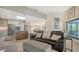 Open living space with comfortable seating and kitchen views at 269 Pine Ranch Trl, Osprey, FL 34229