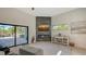 Living room features a fireplace, sliding glass doors, and a view of the pool at 269 Pine Ranch Trl, Osprey, FL 34229