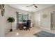 Home office with desk, chair, and plenty of natural light at 269 Pine Ranch Trl, Osprey, FL 34229