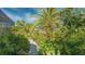Garden path lined with lush tropical plants at 269 Pine Ranch Trl, Osprey, FL 34229