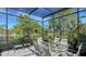 Spacious screened-in patio overlooking a lake at 269 Pine Ranch Trl, Osprey, FL 34229