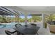 Inviting pool area with patio furniture and a screened enclosure at 269 Pine Ranch Trl, Osprey, FL 34229