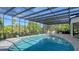 Large screened in pool with a spacious patio area at 269 Pine Ranch Trl, Osprey, FL 34229