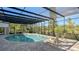 Relaxing screened pool with lounge chairs and a large patio at 269 Pine Ranch Trl, Osprey, FL 34229