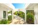 Pathway to home with lush landscaping and tropical plants at 269 Pine Ranch Trl, Osprey, FL 34229