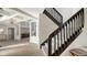 Modern dark wood staircase with simple, clean lines at 269 Pine Ranch Trl, Osprey, FL 34229