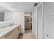 Modern bathroom with updated vanity and tile flooring at 310 Wexford Ter # 164, Venice, FL 34293