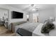 Bright bedroom featuring a large TV and ample dresser space at 310 Wexford Ter # 164, Venice, FL 34293