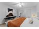 Bright bedroom with king-size bed and stylish decor at 310 Wexford Ter # 164, Venice, FL 34293