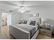 Spacious bedroom with king-size bed and ensuite bathroom at 310 Wexford Ter # 164, Venice, FL 34293