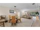 Bright dining area with glass table and wicker chairs at 310 Wexford Ter # 164, Venice, FL 34293