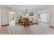 Dining area with glass-top table and wicker chairs at 310 Wexford Ter # 164, Venice, FL 34293
