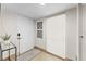 Modern entryway with white door and window blinds at 310 Wexford Ter # 164, Venice, FL 34293