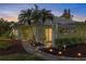 Well-maintained house with a landscaped walkway and garden at 310 Wexford Ter # 164, Venice, FL 34293