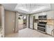 Updated kitchen with stainless steel appliances and access to a patio at 310 Wexford Ter # 164, Venice, FL 34293