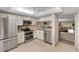 Modern kitchen with stainless steel appliances and granite countertops at 310 Wexford Ter # 164, Venice, FL 34293