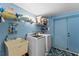 Laundry room with washer, dryer and extra storage at 310 Wexford Ter # 164, Venice, FL 34293