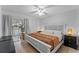 King-size bed, ceiling fan, and access to a private patio at 310 Wexford Ter # 164, Venice, FL 34293