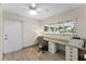 Home office with built-in desk and view of the backyard at 310 Wexford Ter # 164, Venice, FL 34293