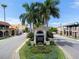 Aerial view of Venice town square, featuring shops and a farmers market sign at 310 Wexford Ter # 164, Venice, FL 34293