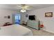 Main bedroom with king-size bed, dresser, and access to other rooms at 3404 Falcon Pl, Bradenton, FL 34210