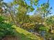 Peaceful view of a canal with lush landscaping at 3404 Falcon Pl, Bradenton, FL 34210