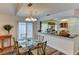 Open concept dining area with a view of the kitchen at 3404 Falcon Pl, Bradenton, FL 34210