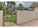 Ornate iron gate leading to a private courtyard at 3404 Falcon Pl, Bradenton, FL 34210
