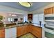 Kitchen with granite countertops, wood cabinets, and modern appliances at 3404 Falcon Pl, Bradenton, FL 34210