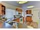 Kitchen features wood cabinets, granite countertops, and modern appliances at 3404 Falcon Pl, Bradenton, FL 34210