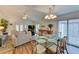 Open living and dining area with vaulted ceilings at 3404 Falcon Pl, Bradenton, FL 34210
