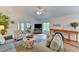 Open living room features vaulted ceilings and a neutral color scheme at 3404 Falcon Pl, Bradenton, FL 34210