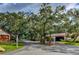 Residential street lined with lush trees and charming homes at 3404 Falcon Pl, Bradenton, FL 34210
