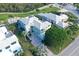 Large home with tile roof, driveway and lush landscaping at 3408 Fair Oaks Ln, Longboat Key, FL 34228