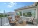Relaxing balcony with seating and water views at 3408 Fair Oaks Ln, Longboat Key, FL 34228